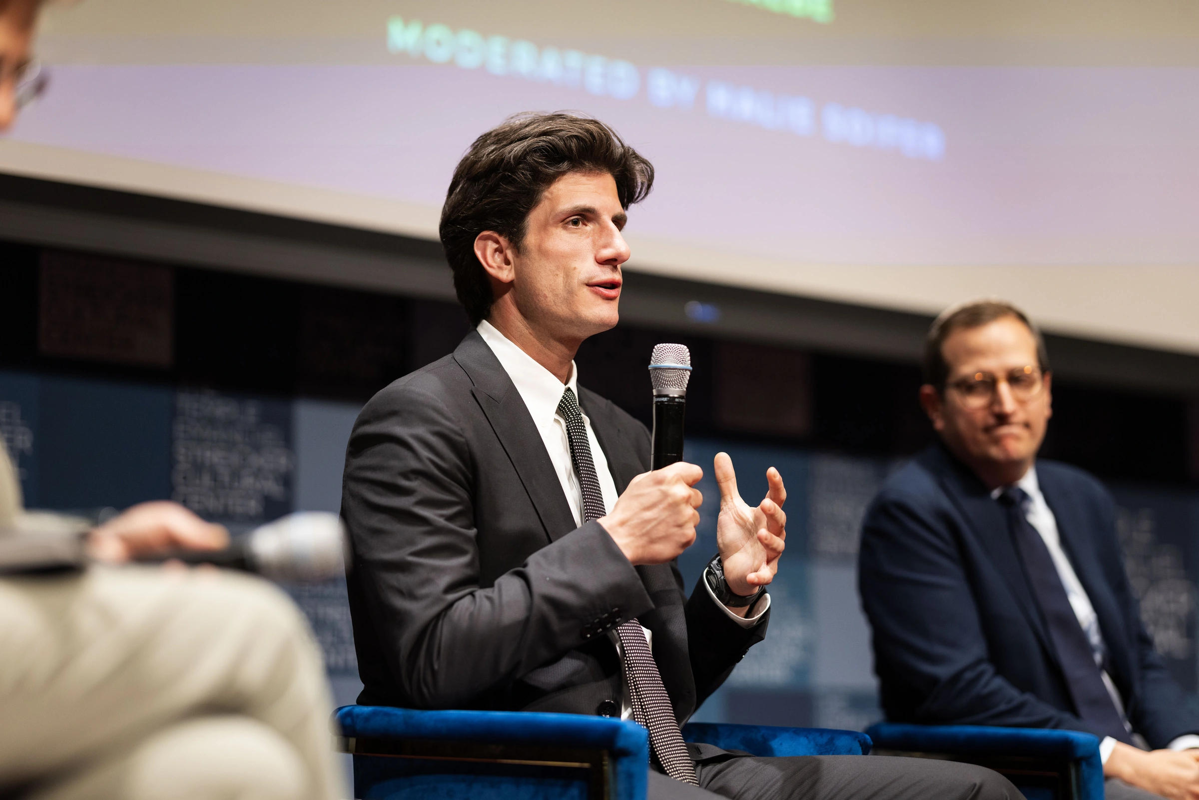 A speaker addressing a candidate forum in New York City