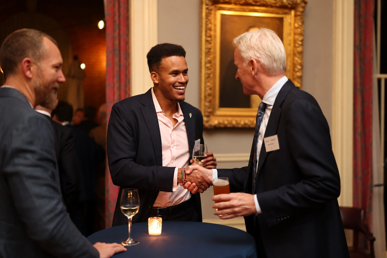 A handshake and conversation at a professional reception