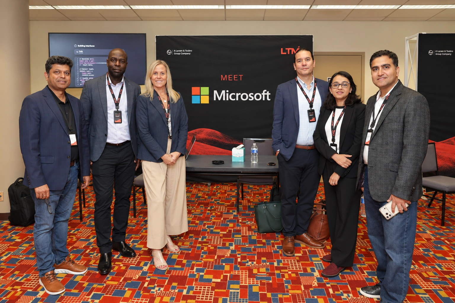 Attendees posing together at a business meeting