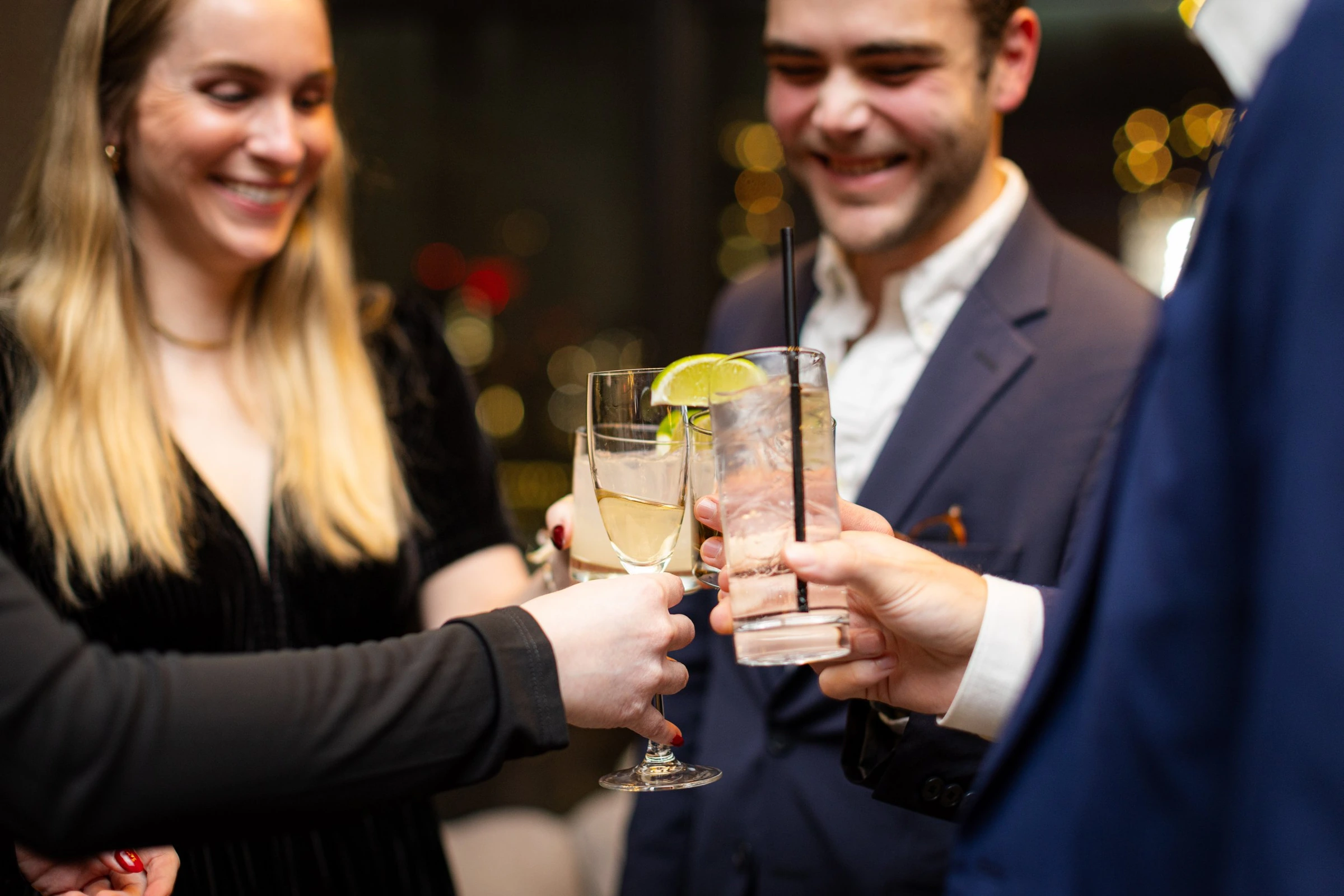 Colleagues raising their glasses during a reception