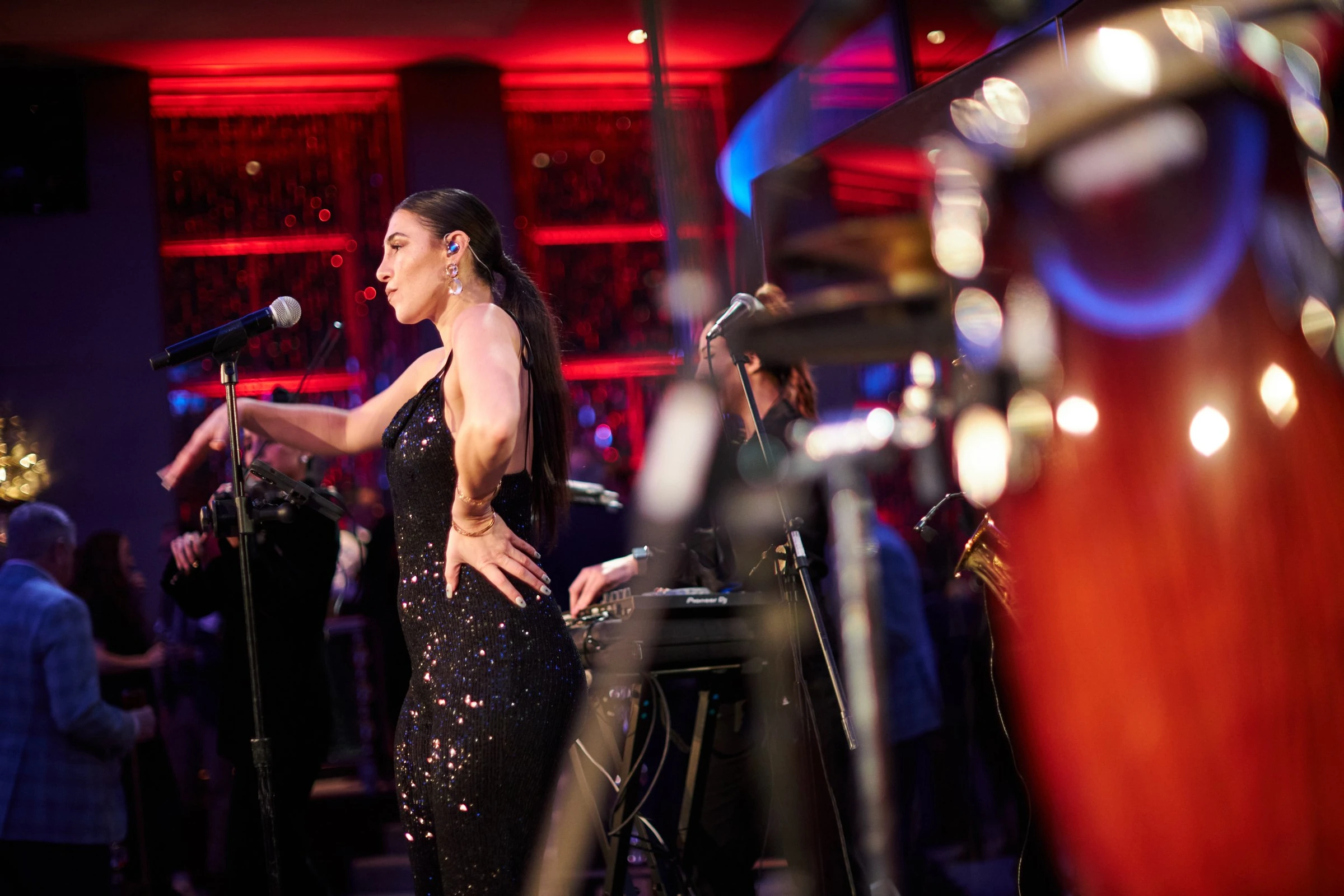 A vocalist performing during evening event entertainment