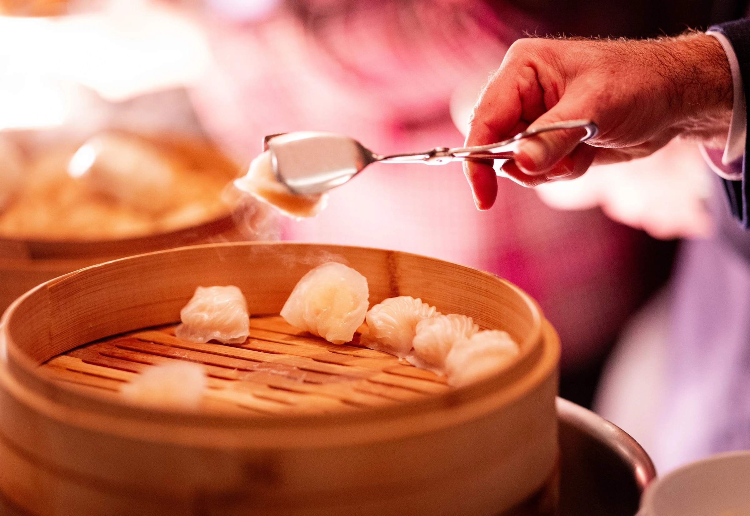 A server preparing food during an event reception