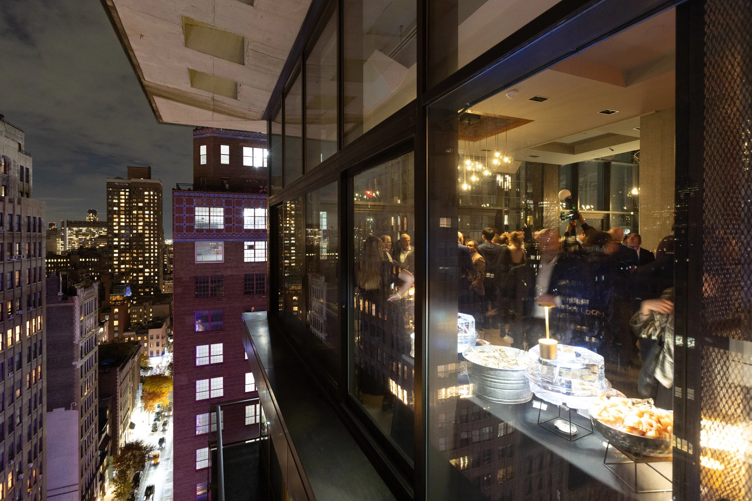 An event venue and candlelit tables before a reception