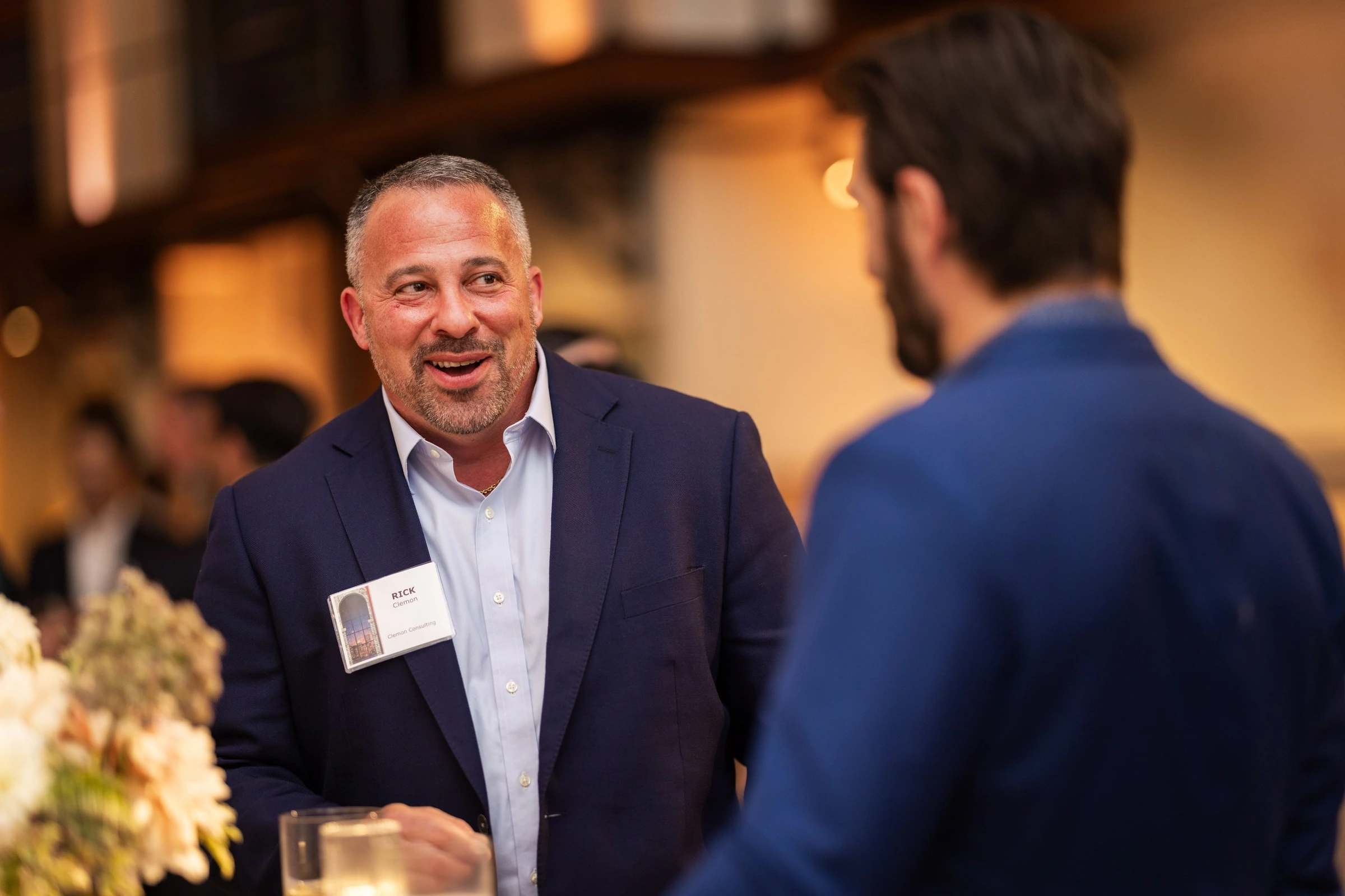 Two guests talking at a business reception