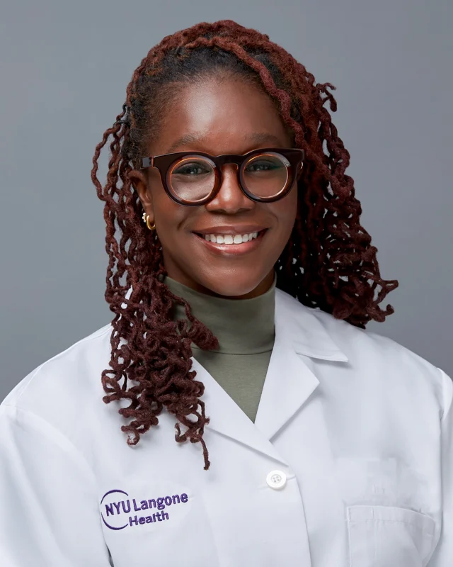 Medical professional photographed in a white coat