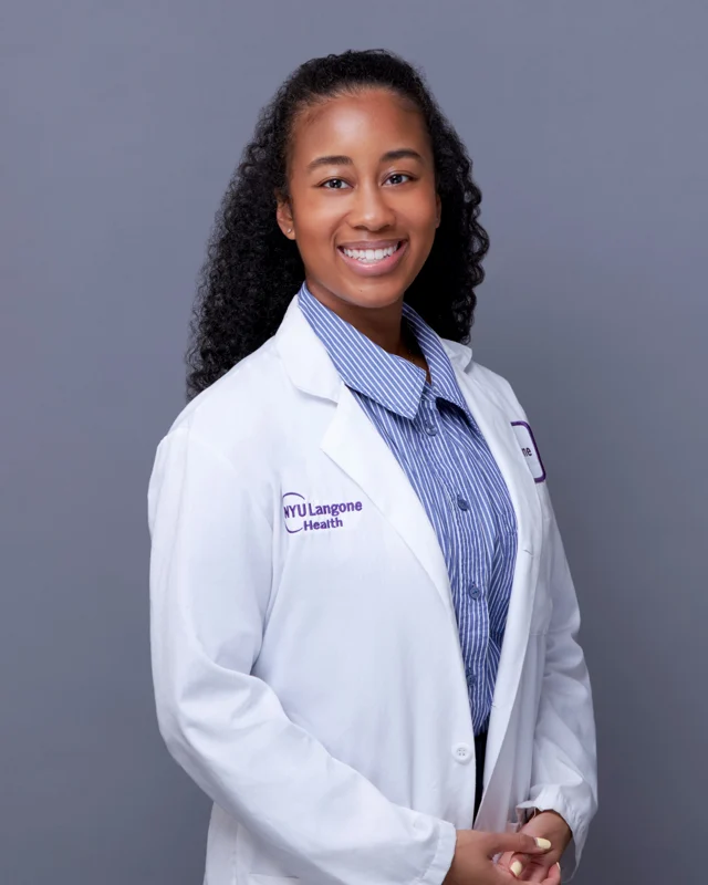Medical professional photographed in a white coat
