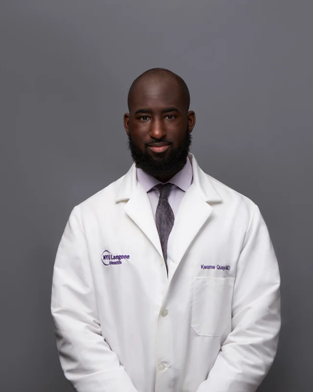 Medical professional photographed in a white coat
